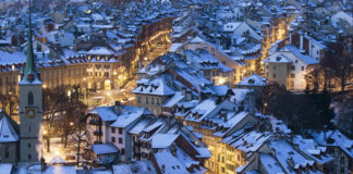 Snow covers the roofs of the houses in the city of Bern, Switzerland.