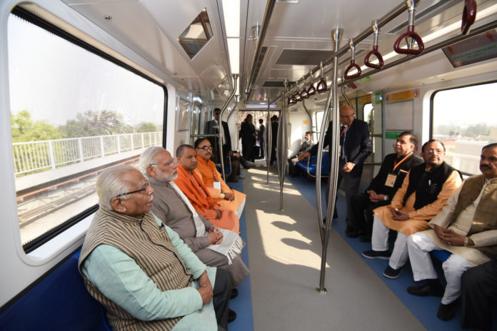 The Prime Minister, Shri Narendra Modi taking a ride in Metro from Botanical Garden Station to Okhla Bird Sanctuary along with the Governor of Uttar Pradesh, Shri Ram Naik and the Chief Minister, Uttar Pradesh, Yogi Adityanath and other dignitaries after its inauguration, at Noida, Uttar Pradesh on December 25, 2017.