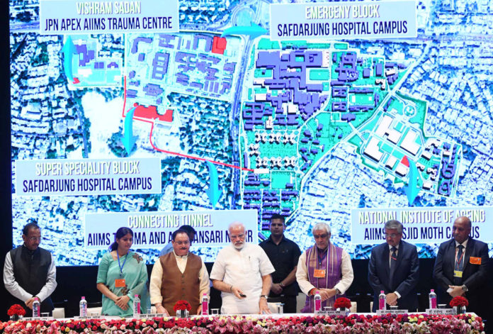 The Prime Minister, Shri Narendra Modi launching the various healthcare projects, at AIIMS, in New Delhi on June 29, 2018. The Union Minister for Health & Family Welfare, Shri J.P. Nadda, the Ministers of State for Health & Family Welfare, Shri Ashwini Kumar Choubey and Smt. Anupriya Patel and other dignitaries are also seen.