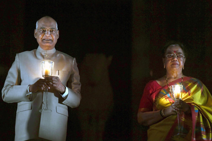 The President, Shri Ram Nath Kovind and the first lady Smt. Savita Kovind lighting candles on 9 PM at Rashtrapati Bhavan to express solidarity in fight against COVID-19 pandemic, in New Delhi on April 05, 2020.