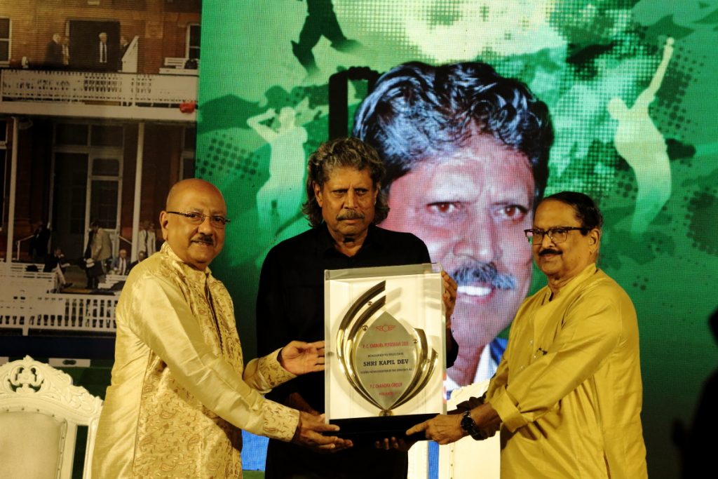 Kapil Dev receives P.C. Chandra Award Trophy
